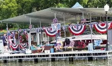 A patriotic-themed boat above won the Council Grove Lake Regatta while the festive K20 site won the Lakefront Decorating contest. Both contests were sponsored by the Council Grove Lake Community Association.